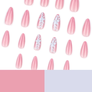 Pink gradient almond press-on nails with white floral patterns and cat-eye glitter finish