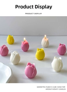 Detailed view of tulip-shaped scented candles in pink, yellow, and white colors