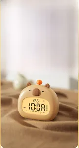 Detail of Capybara smart alarm clock showing backlight screen with temperature and time