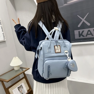 Waterproof light blue diaper backpack with large capacity and matching coin purse charm