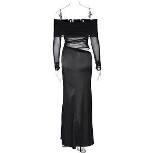 Rear view of black long-sleeve dress with sheer mesh sleeves and hollow waist cutouts