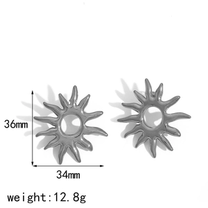 Detailed view of sun-shaped titanium steel earrings with 36mm height and 34mm width specs