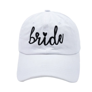 Close-up of white cotton baseball cap featuring black bride embroidery and heart detail