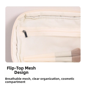Detail of floral makeup bag featuring internal mesh zipper pocket for organized storage