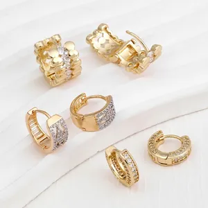 Three elegant gold-plated hoop earrings with sparkling cubic zirconia on a white display