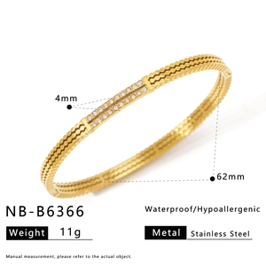 Detail of 4mm wave pattern gold plated stainless steel bracelet with double row cubic zirconia