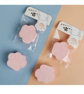 Detailed view of pink cat claw makeup sponges in cute retail hanging card packaging