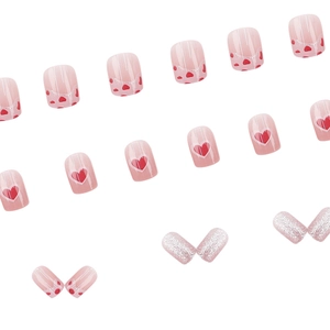 Pink French press-on nails with heart patterns and silver glitter in square oval shape