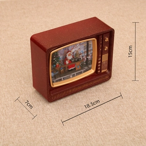 Detailed view of vintage TV Christmas snow globe with 18.5cm x 7cm x 15cm dimensions