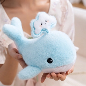 Cute light blue whale plush toy with cloud water spray detail and soft fluffy texture
