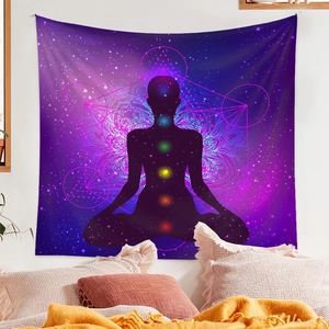 Detailed view of tapestry featuring meditation chakra symbols and mandala in a bedroom