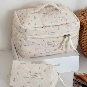Quilted beige cosmetic bag set with cute bear patterns and textured fabric detail