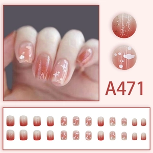 Pink gradient press-on nails set with cute cloud and star patterns for a dreamy look