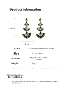 Detailed view of layered fan-shaped drop earrings with green rhinestones and 925 silver pins