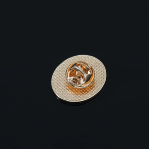 Detailed macro view of the golden metal butterfly clutch back for secure pin fastening