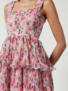 Detail of floral tiered dress featuring smocked bodice and layered ruffle skirt design