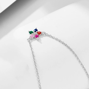 Detailed close-up of S925 silver flower pendant with colorful cubic zirconia stones