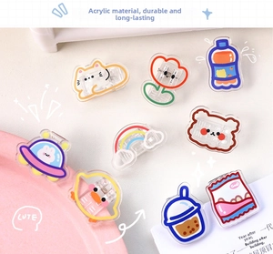 Close-up of cute cartoon acrylic clips for snacks and papers in various animal shapes