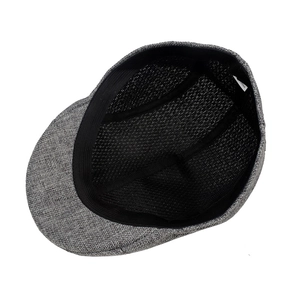 Detail of light gray linen flat cap showing breathable black mesh lining and inner texture