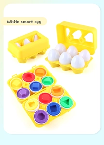 Detail van 6 witte eieren met gekleurde vormen en een gele opbergdoos voor kinderen