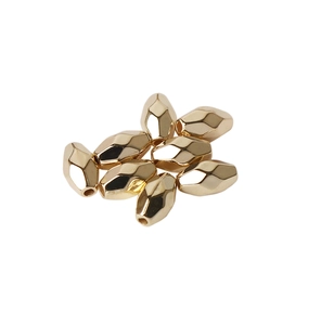 Macro shot of faceted golden CCB spacer beads for DIY jewelry making and craft projects