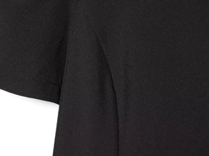 Detailed close-up showing the professional stitching and black woven texture on the dress