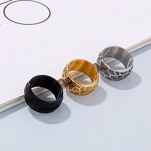 Detailed close-up of retro stainless steel drum rings in black, gold, and silver finishes