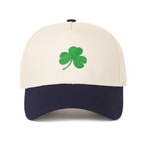Close-up of the green clover embroidery and contrast stitching on a cotton baseball cap