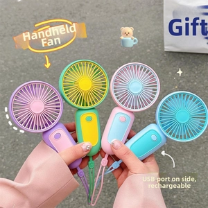 Detail showing four colorful mini USB fans with side charging ports and matching lanyards