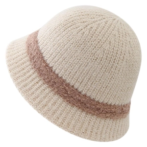 Winter chunky knit bucket hat in beige with brown plush trim for a cozy fashion look