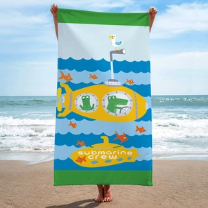Microfiber beach towel with cartoon submarine and crocodile pattern on a sunny beach