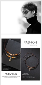 Detail of vintage wooden bead layered necklace with a bronze hollow heart pendant for men