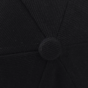 Detailed close-up of the black cotton baseball cap crown with top button and stitching