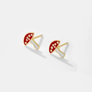 Close-up of S925 silver mushroom stud earrings with red and white enamel and gold plating
