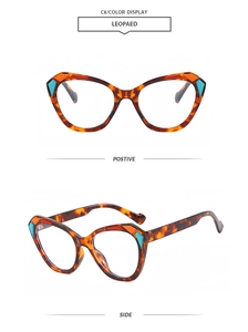 Detail view showing cat-eye frame in leopard print with orange and cyan contrast accents
