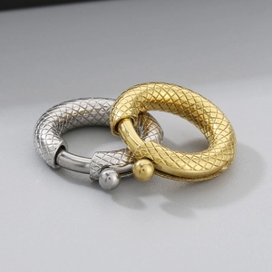 Detailed view of gold and silver snake texture spring clasps for jewelry making