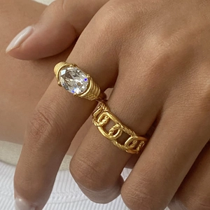 Vintage gold-plated titanium steel ring set with oval white zircon and chain link design