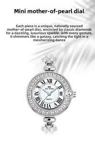 Close-up of mother of pearl dial with Roman numerals and diamond bezel on silver watch