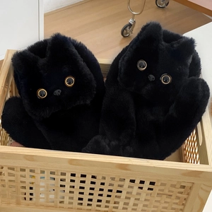 Winter warm black cat plush slippers with cute big eyes in a cozy woven basket