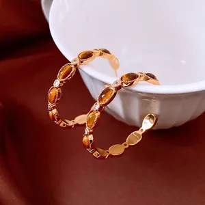 Boucles d'oreilles vintage en forme de C plaquées or 18 carats avec pierres brunes sur céramique