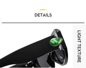 Close-up of black fashion sunglasses with green gemstone texture on the temple hinges