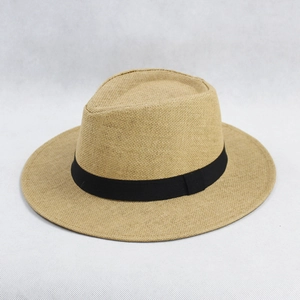 Close-up of the fine weave texture and black ribbon band on this summer straw sun hat
