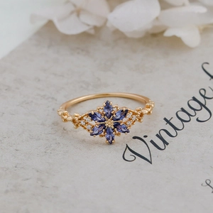 Detailed macro view of vintage S925 silver flower ring with purple marquise stones