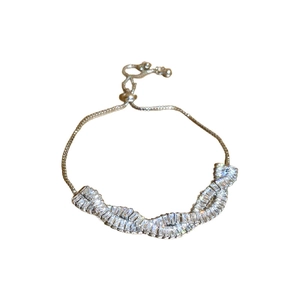 Elegant silver twisted zircon bracelet with adjustable slider chain on white background