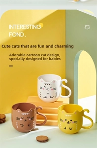 Detail showing cat-shaped children's rinsing cups in white, brown, and yellow set