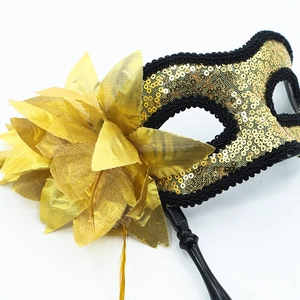 Golden masquerade hand-held mask with sequined fabric flowers and black handle stick
