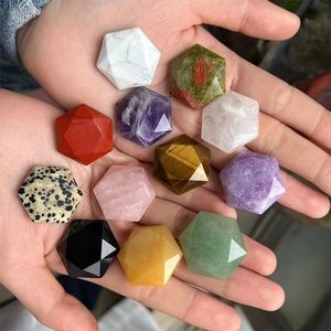 Collection of multifaceted natural crystal star stones in various healing gemstones