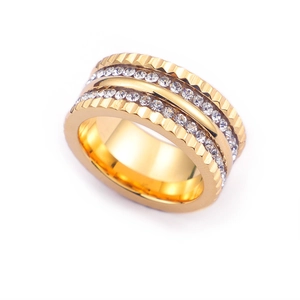 Fashionable gold wide band ring with pavé-set cubic zirconia and textured edges