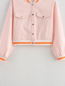 Pink cropped jacket detail with orange-white striped trims and metal button closure