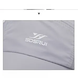 Close-up of quick-dry baseball cap in light grey with premium stitching and SDSRUI logo